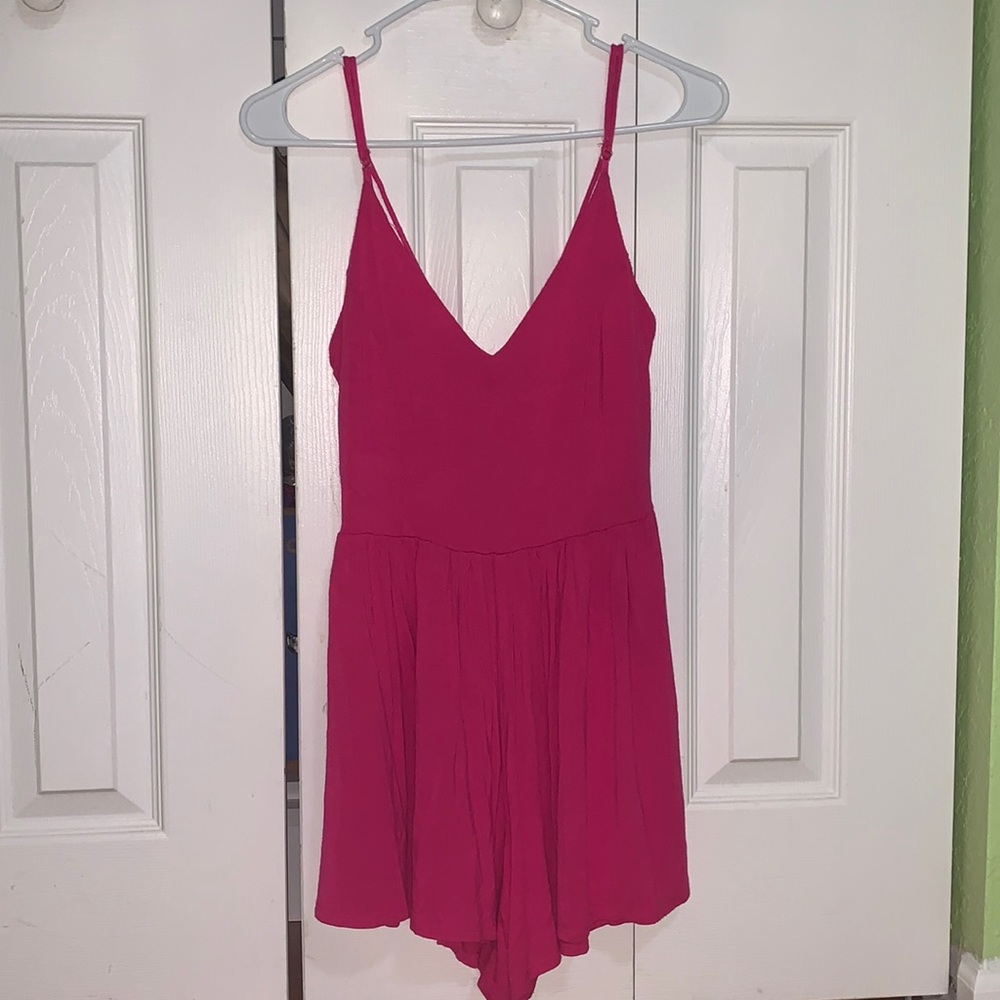 Pink romper with back criss cross detail